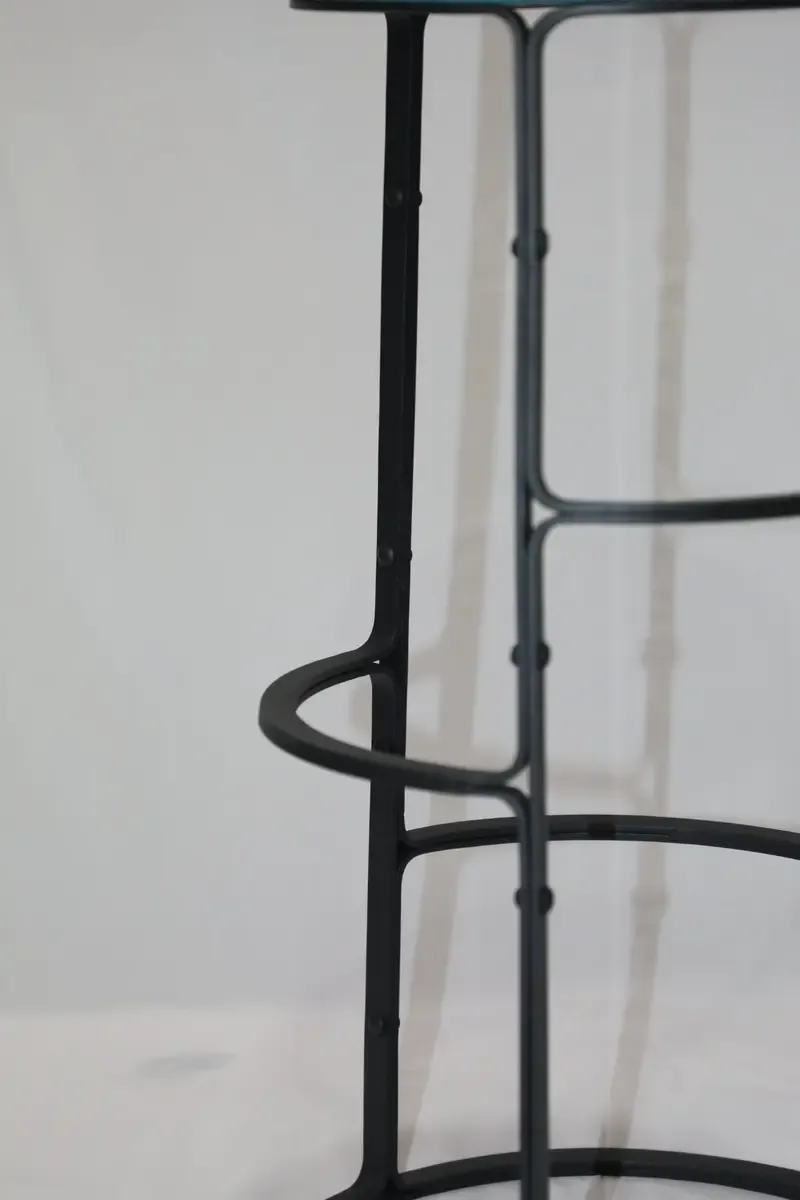 Close view of a stool leg and the lower ring with the fixing detail
