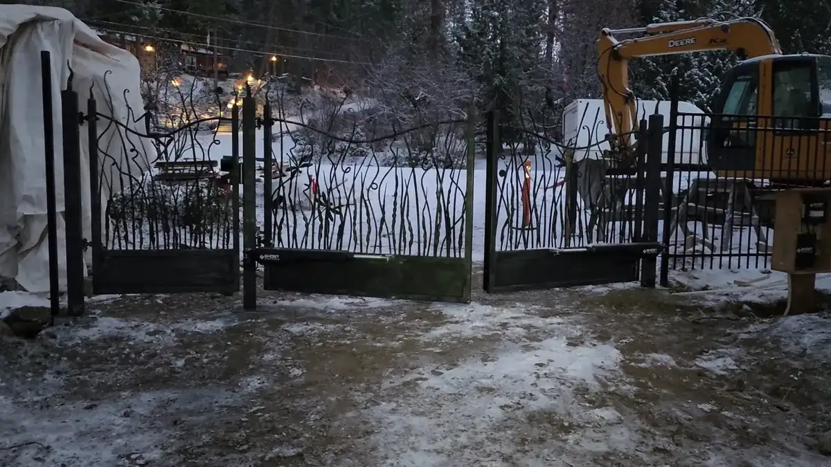 Forged steel driveway gate installed at a North Shore property