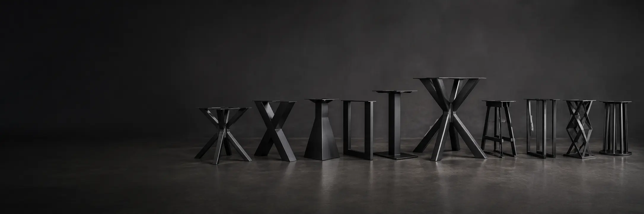Row of black steel table legs and pedestal bases from the TrussMetal catalogue