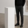 Steel display pedestal scale reference Steel display pedestal shown with person for scale reference