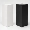 Matte White and Matte Black steel display pedestals Matte White and Matte Black steel display pedestals side by side