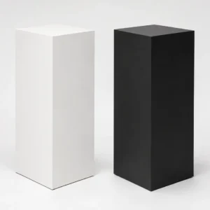 Matte White and Matte Black steel display pedestals Matte White and Matte Black steel display pedestals side by side