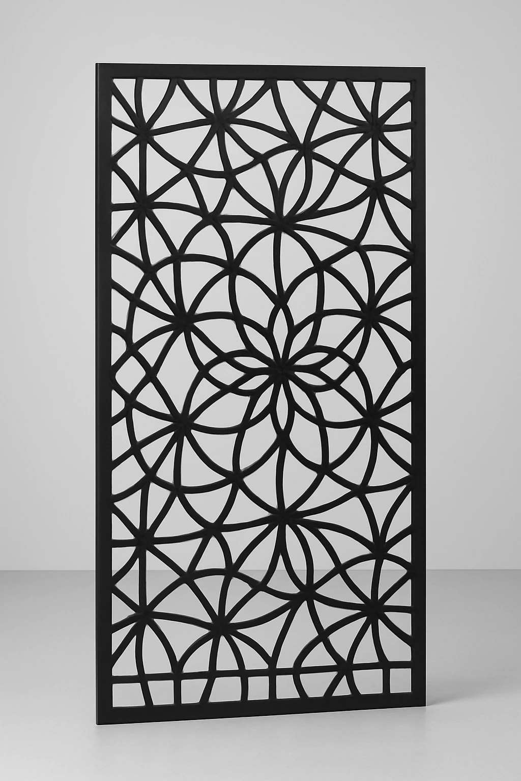 Kaleidoscope geometric pattern, a laser-cut steel decorative screen panel in matte black